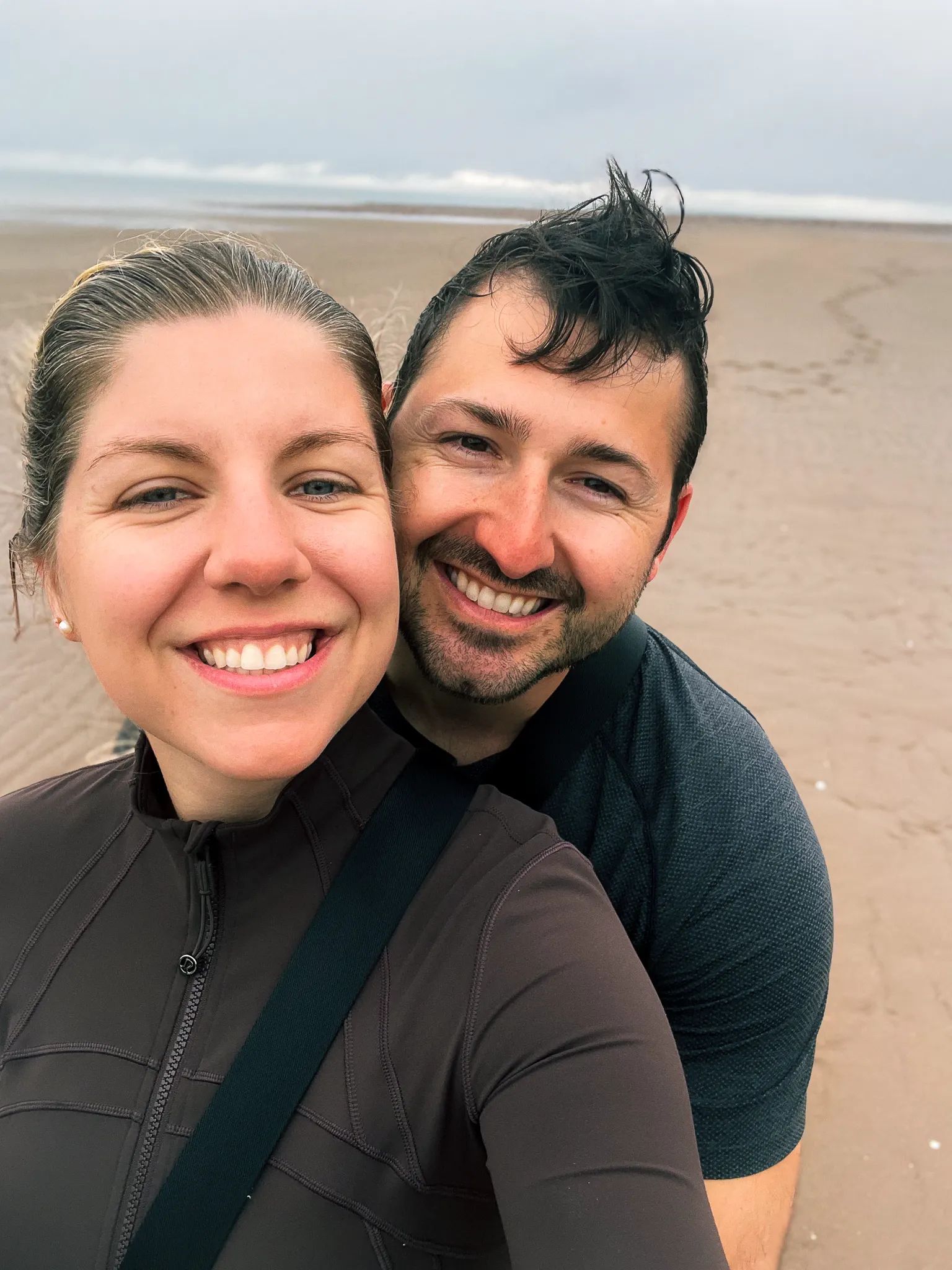 A couples Photo of Anita and Luc at Long Beach, New Brunswick looking towards the water from the beach